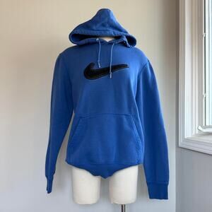 Blue Nike hoodie with embroidered black carpet like material swoosh